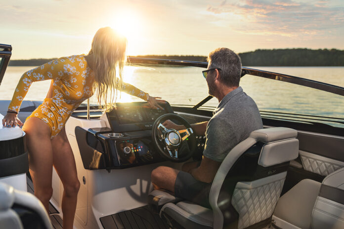 Father and daughter at the helm of an SLX 260 Surf