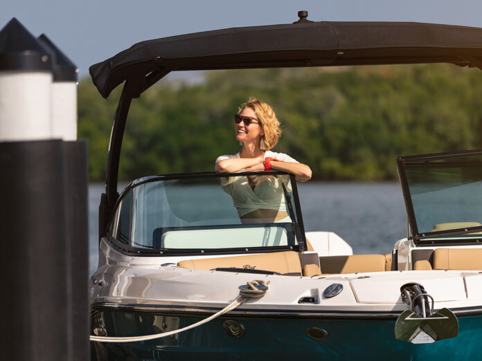 Women aboard a docked SLX 280 Outboard