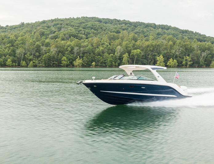 2024-SLX-310-Outboard-SXO310-running-port-bow-three-quarter-00195